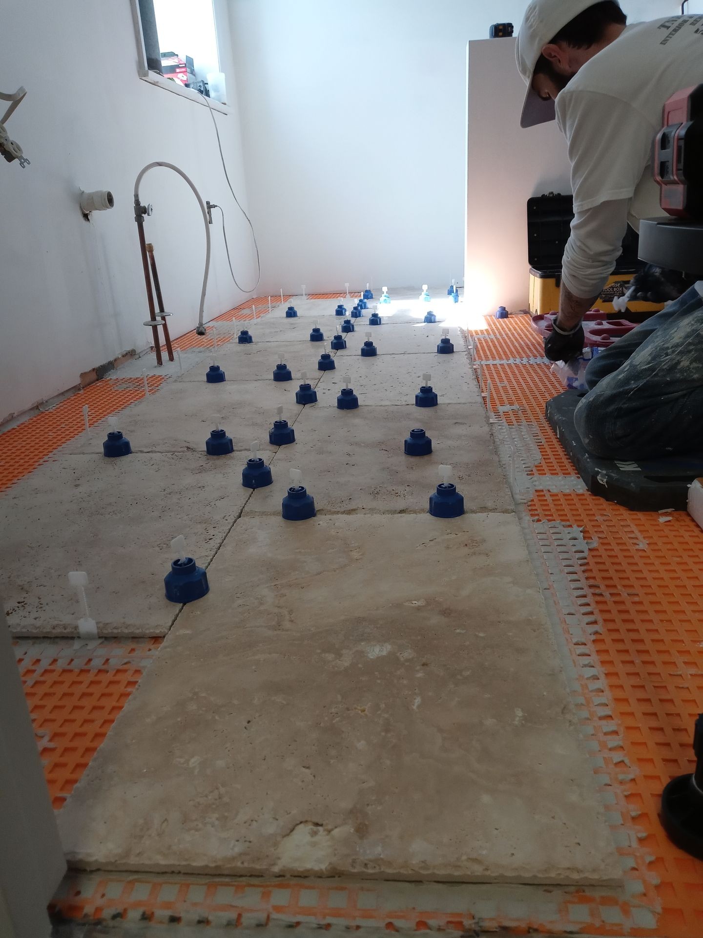 Floor tile installation over schluter ditra
